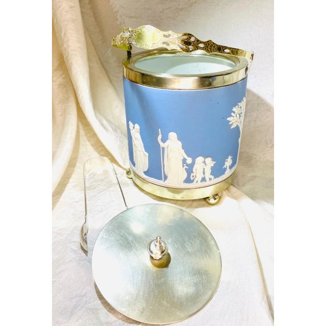 Discover a true Victorian-era treasure: this authentic late 19th-century Wedgwood blue jasperware biscuit barrel,...