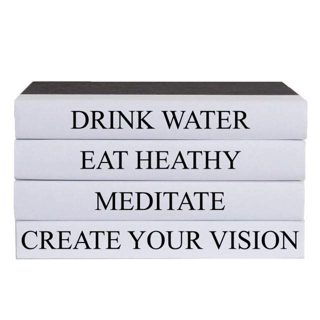 Let your thoughts be seen with these four decorative hardback books in black with white spines. By Booth & Williams.