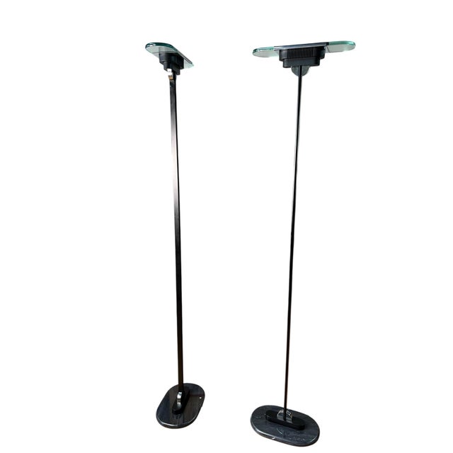 This is a fantastic pair of vintage floor lamps designed by Robert Sonneman. One of the plugs has been replaced with a...