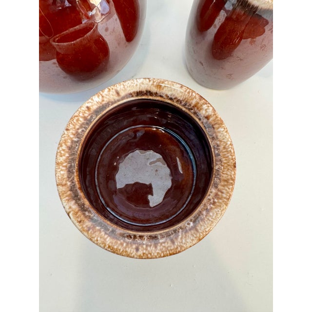 This gorgeous vintage tea set features the iconic Mirror Brown (often called "Mirror Glaze") drip finish by Hull Pottery....