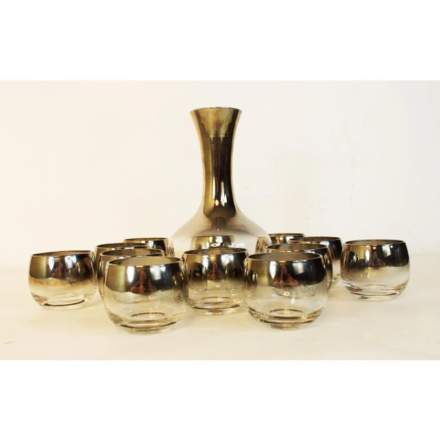 As seen on Mad Men. 12 quintessential atomic, mid-century modern era cocktail glasses and carafe. Roll in style! Glasses...