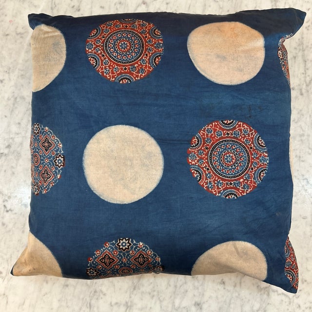 This Alamwar pillow is made by hand and dyed with natural indigo extracted from the plant. The dye will age with time and...