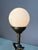 Antique bronze globe lamp with a statuesque woman figure on the stem. Corded electric. Comes with white glass globe and...