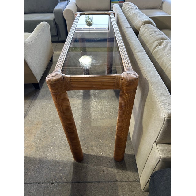 Fabulous twisted pencil reed console or sofa table with removable smoked glass top.