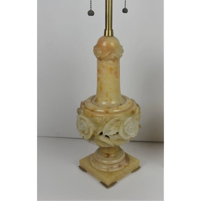 Pair of large-size alabaster table lamps. The base is supported on brass feet on each corner, and the finals are original...