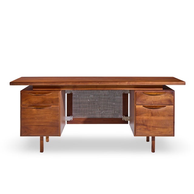 Jens Risom Mid Century Walnut and Cane Executive Desk This desk measures: 72 wide x 30 deep x 30 high, with a chair...
