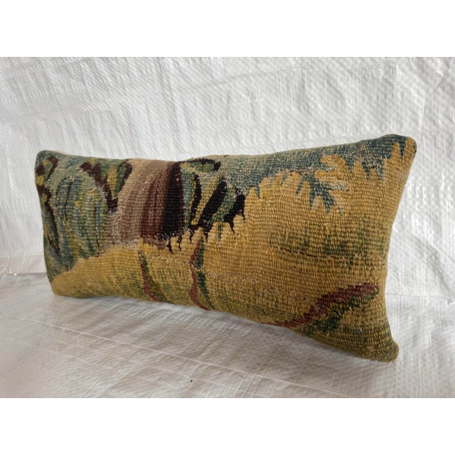 This authentic 17th century Flemish tapestry pillow is crafted from a handwoven verdure fragment originating in Flanders,...