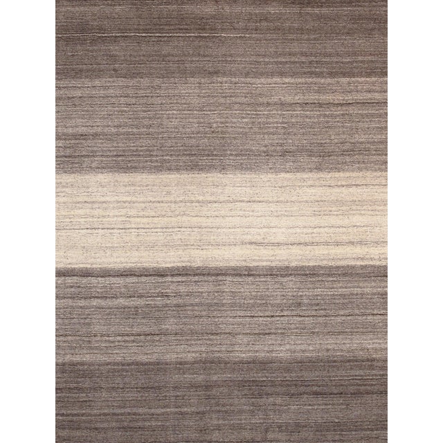 The tribal motifs of this traditional area rug collection reflect the soft pile and unparalleled elegance of classic...
