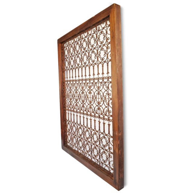 Solid teak wood frame with inset hand forged stunning iron screen. Great for use indoors or out with chestnut brown...
