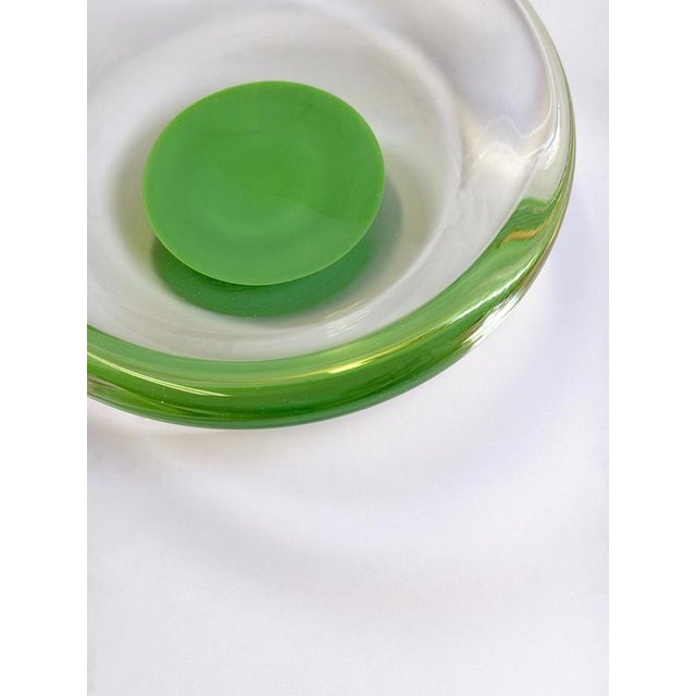 Modernist style Murano glass bowl produced in Italy during the 1970s. Executed in clear glass with a submerged opaque...