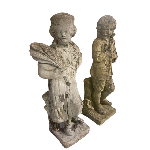this is a delightful pair of vintage cast stone statues. Standing at 30 inches tall, these figures depict a young boy and...