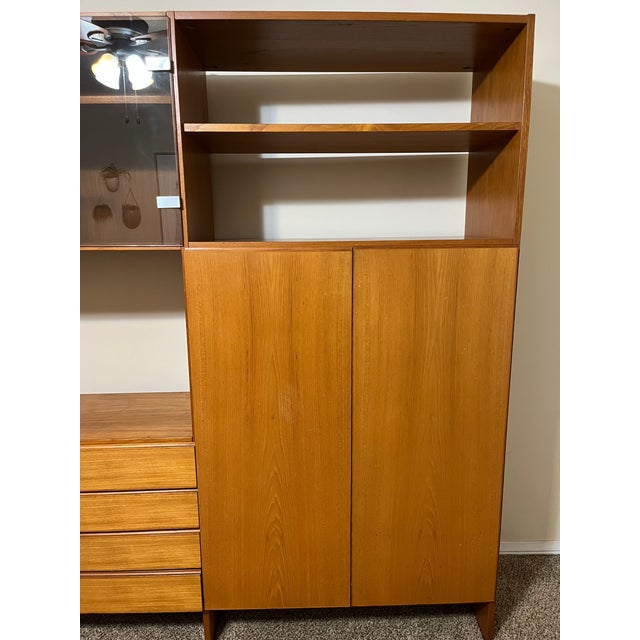 Teak Wall Unit for Sale - Excellent Condition! Approximately 6 feet high and 9 feet long, this stunning teak wall unit is...