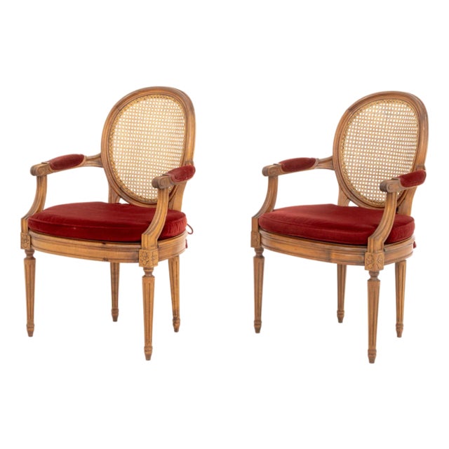 Pair of Louis XVI Style Red Velvet Upholstered Cane Paneled Walnut Fauteuils For Sale