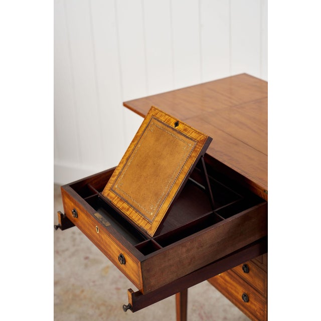 An unusual early 19th century English mahogany writing cabinet with lots to share. Top opens to allow top drawer to...