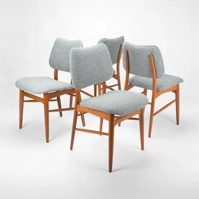 These mid-century dining chairs are a perfect example of the timeless elegance and functional design of this period. These...