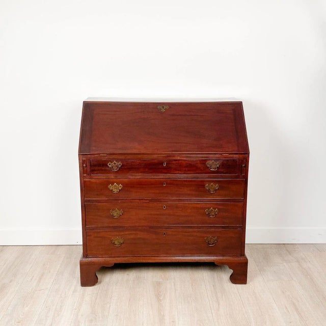 A Chippendale slant front desk, England, circa 1790. Measures 35" d when open.