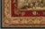 This beautiful horizontal Aubusson tapestry depicts a scene in which a young male is seen picking grapes as two females...