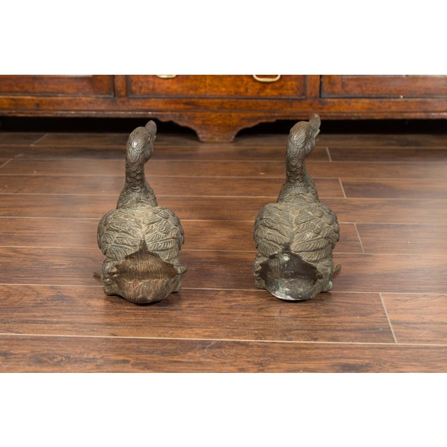 A pair of bronze swimming ducks from the mid-20th century. Created during the second half of the 20th century, each of...