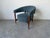 Stylish 1960s Mid-Century Modern barrel lounge chair featuring a distinctive “floating” design with a sculptural curved...