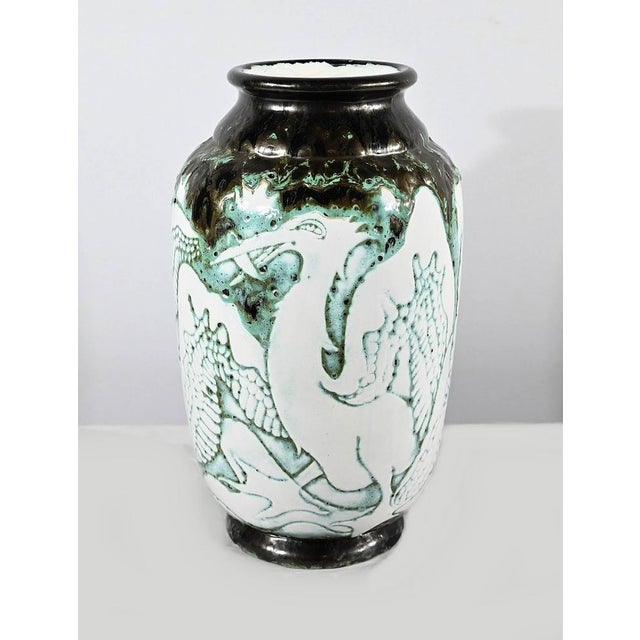 Large enameled ceramic vase decorated with Pélicans with deployed wings. The colors are nuanced and offer a gradient of...