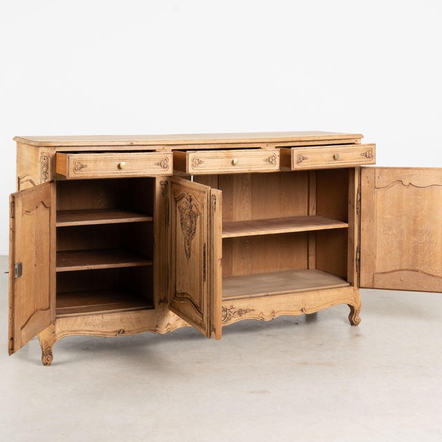 19th century French sideboard, crafted in oak and bleached to create a lighter finish that beautifully highlights the...