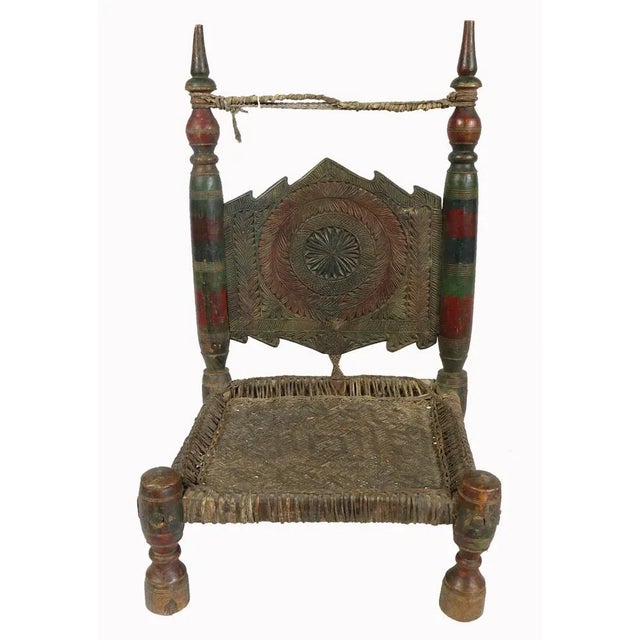 Unique 20th century antiquity Low chair from Swat-valley Pakistan. Object: Chair Material/technique: Wood, hide / hand-...