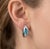 Gracefully modern with a refined brilliance, these elegant earrings showcase a striking combination of vibrant color and...