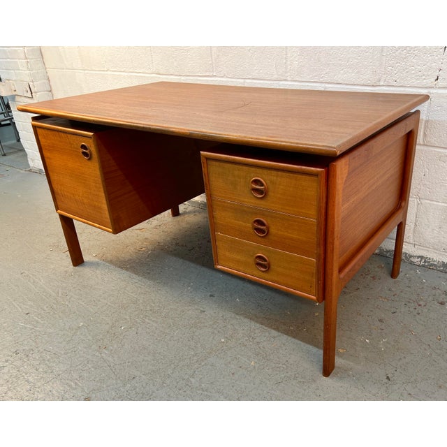 Stunning Mid-Century Danish Modern executive desk by Art Furn of Denmark. Expertly crafted in richly grained teak, this...