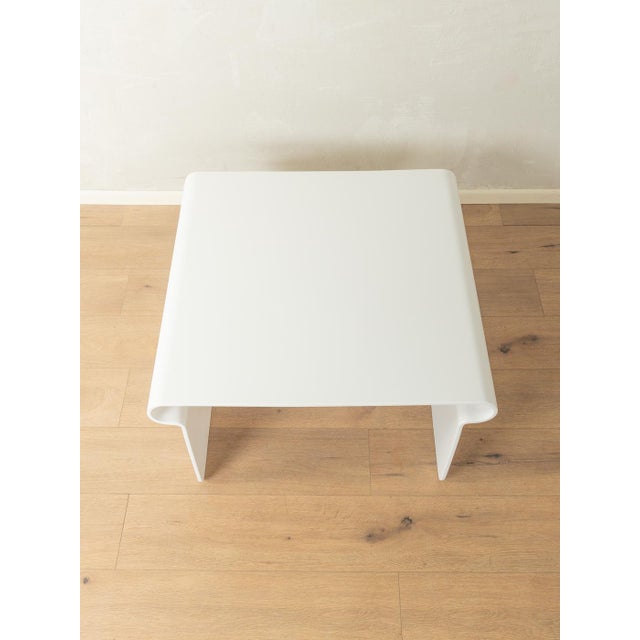 Space Age coffee table from the 1970s. High-quality frame made of white plastic. Quality features: Excellent workmanship...