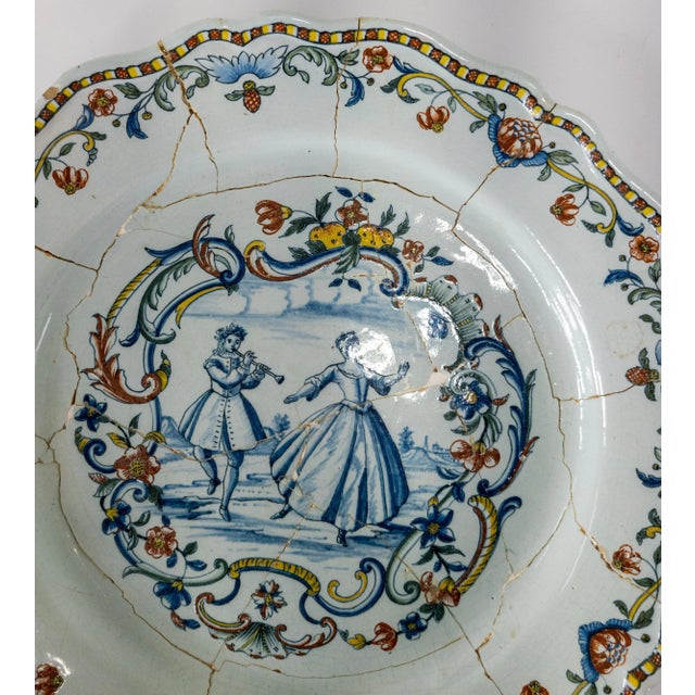 We are selling this great French polychrome charger. This faience charger is decorated with fine polychrome decoration...