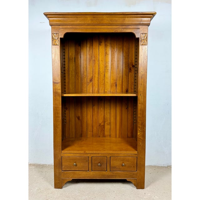 Spanish bookcase cabinet dating from the mid-20th century. Crafted in wood, it features a tall open upper section with two...