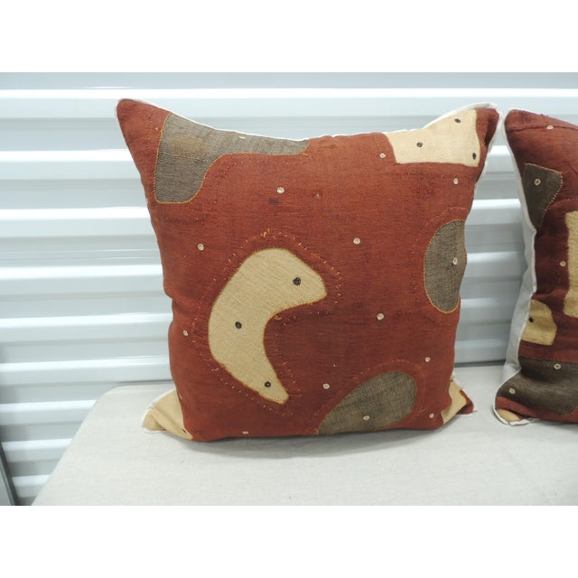 Applique African Raffia, Patchwork and Applique Brown Decorative Pillows. with, custom flat cotton trim in earth-tone...