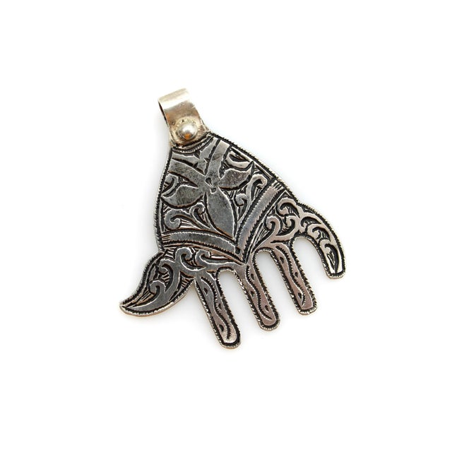 This sterling silver Hand of Fatima, or Hamsa Hand, pendant was acquired on a trip to Morocco. Circa the 1940’s or 1950’s,...