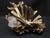 French surrealist designer Claude Victor Boeltz popularized a technique he called "exploded bronze", giving his pieces the...