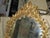 Exquisite in every way, this gilt wood mirror from the 1930's is made from carved acanthus leaves and tiny flowers....