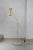Cone double floor lamp by contain dimensions: d12 x h130cm materials: brass structure, opal glass and stone base. Also...
