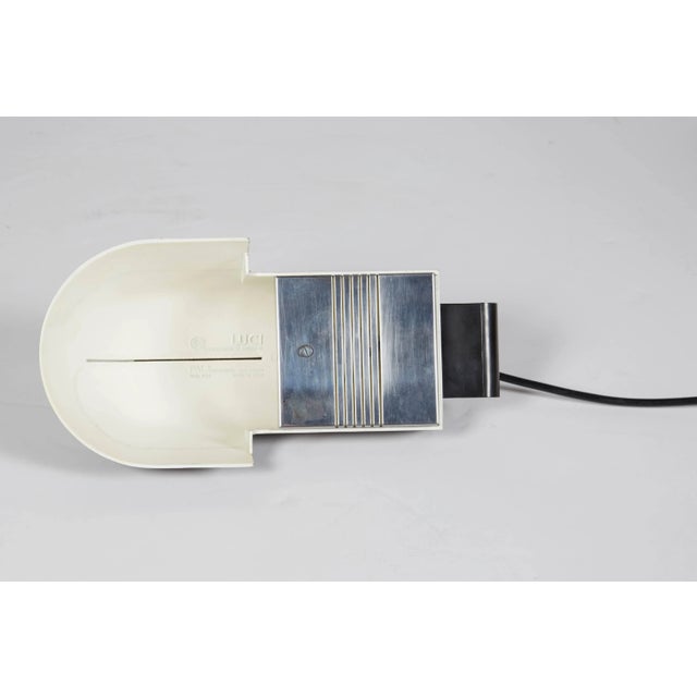 This adjustable desk lamp was designed by D. C. Arnoldi for Italian lighting company Luci illuminaznione d'interni, circa...