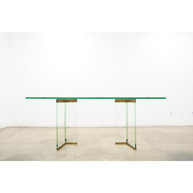 Elegant vintage Leon Rosen glass dining table featuring a thick rectangular glass top with softly rounded corners and a...