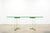 Elegant vintage Leon Rosen glass dining table featuring a thick rectangular glass top with softly rounded corners and a...
