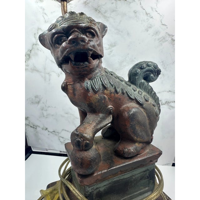 The Frederick Cooper Cast Iron Foo Dog Table Lamp is a rare vintage piece from the 1970s with a unique Asian-inspired...