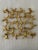 Whimsical figurines connect to form this 3-dimensional wall plaque finished in a metallic gold leaf. Dimensions: 19 W X 19...