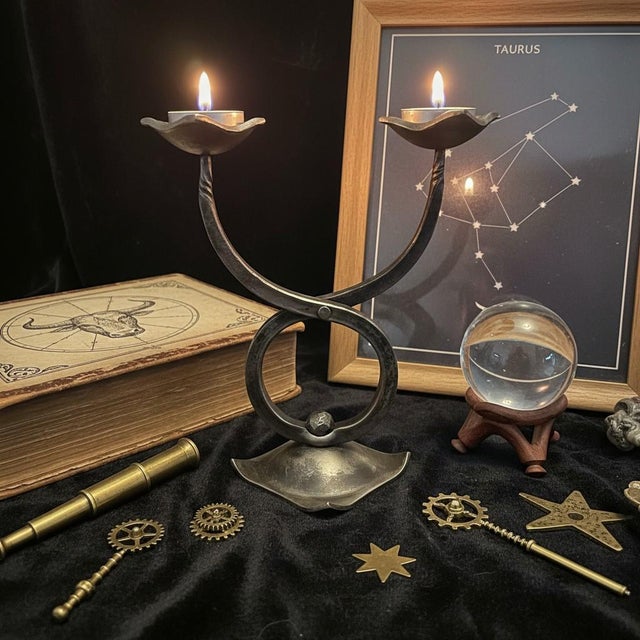 Hand-forged iron Taurus zodiac candle holder by Hefaistos of Prague, Czech Republic. Representing Taurus, one of the...