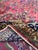 Introduce timeless elegance with this 10x14 Persian-style area rug. Handmade in India from wool, the large rug showcases a...