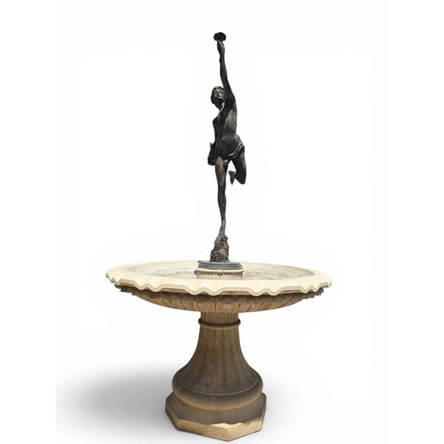 Spectacular monumental classical fountain crafted in marble and adorned with a finely modeled bronze female figure....
