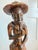 a large and expressive vintage folk art sculpture, hand-carved from a solid piece of dark wood. this piece exhibits a...