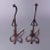 An antique pair of oversized Arts and Crafts andirons in the manner of Yellin offer wrought iron construction with...