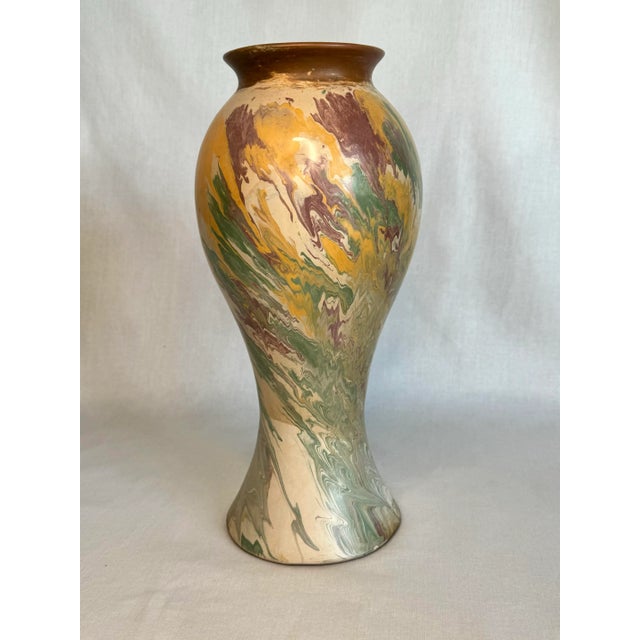 The artistic style of Ozaka pottery is evident in this hand painted tall ceramic vase. The neoclassical style and shape...