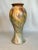 The artistic style of Ozaka pottery is evident in this hand painted tall ceramic vase. The neoclassical style and shape...