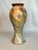 The artistic style of Ozaka pottery is evident in this hand painted tall ceramic vase. The neoclassical style and shape...