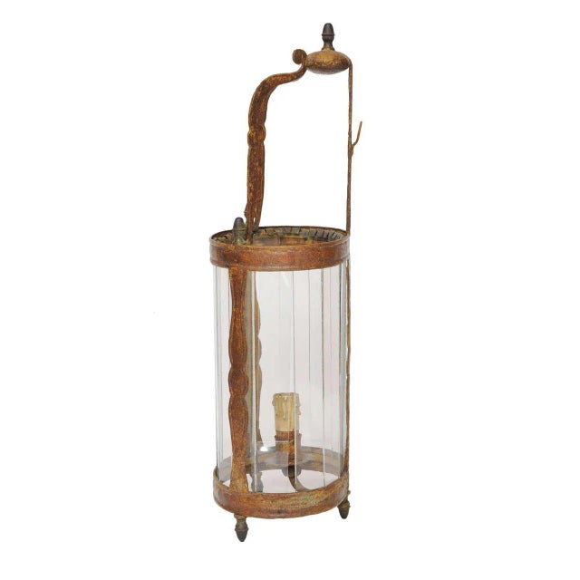 This is a 19th century lacquered wall lantern. It is a lantern that can also be used with candle
